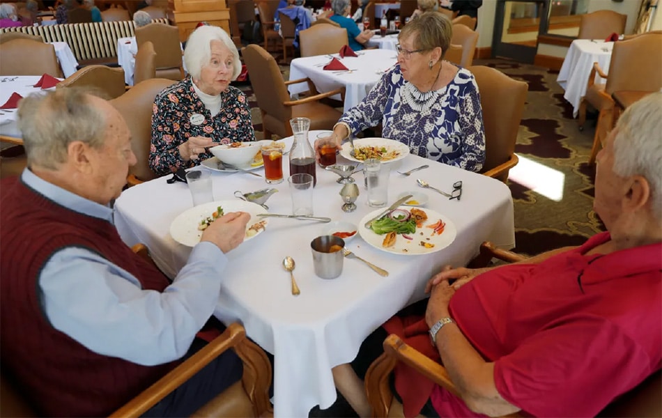 Residents Gene and Sandy Block, and Carole and Paul Kefer, from left, have lunch at Stoneridge Creek Pleasanton retirement